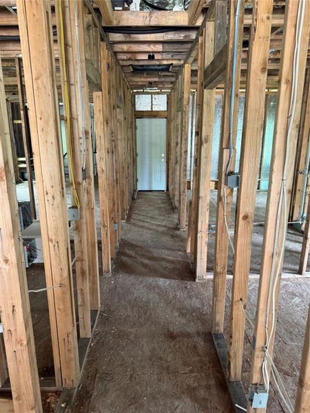 Construction progress - Hallway to the back door leading to the covered back deck. Construction progress - Hallway to the back door leading to the covered back deck.