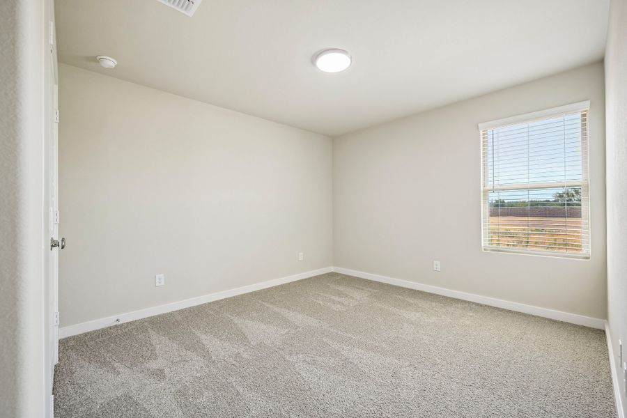 Bedroom in the Harrison home plan by Trophy Signature Homes