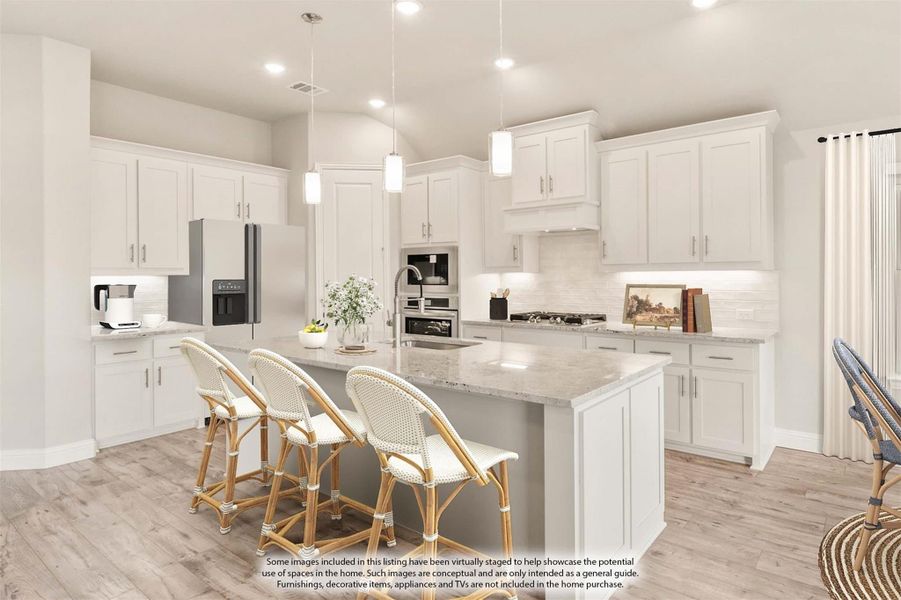 Kitchen with white cabinets, large island with seating, stone countertops, and stainless steel appliances Kitchen with white cabinets, large island with seating, stone countertops, and stainless steel appliances