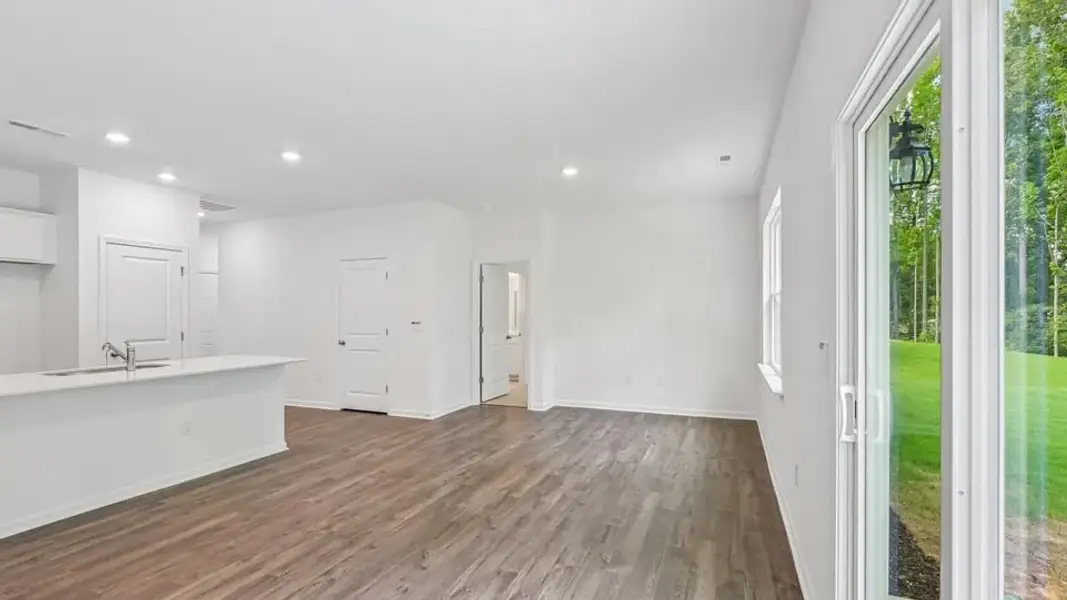 Spacious, unfurnished interior of a new home in The Villas at Laurel Oaks, Sanford (Image 11).