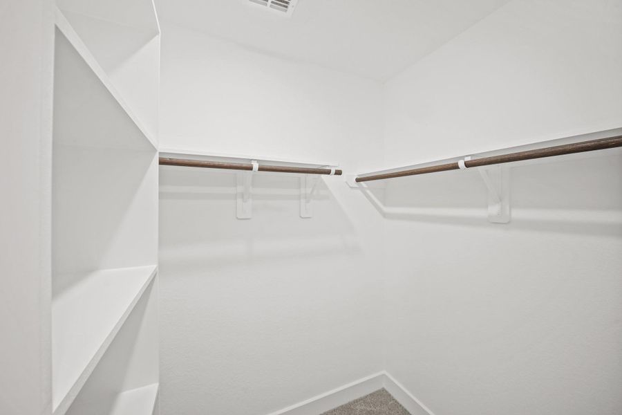 Large walk-in closet in the primary suite Large walk-in closet in the primary suite
