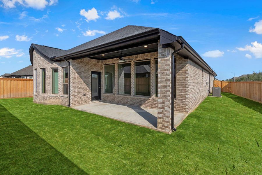 Exterior details and patio area of a home in Dunham Pointe 50', Cypress (Image 21).