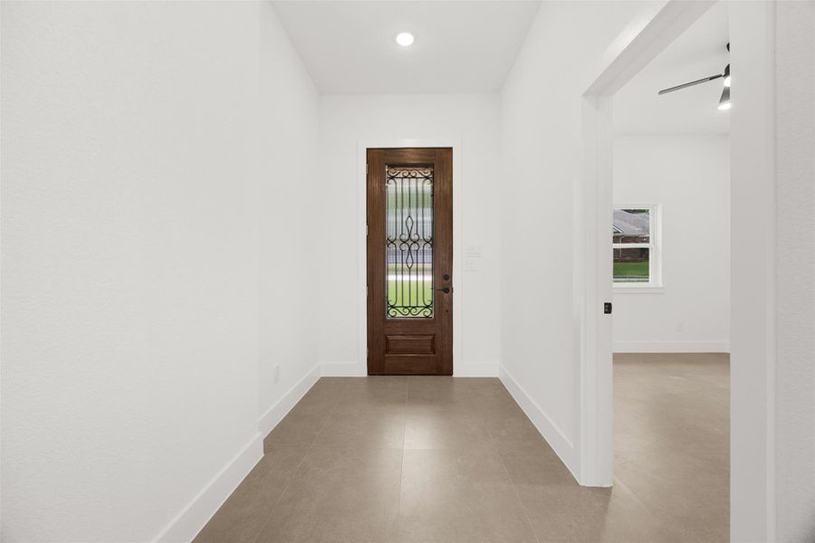 Spacious foyer with soaring ceilings, designer finishes, and abundant natural light.