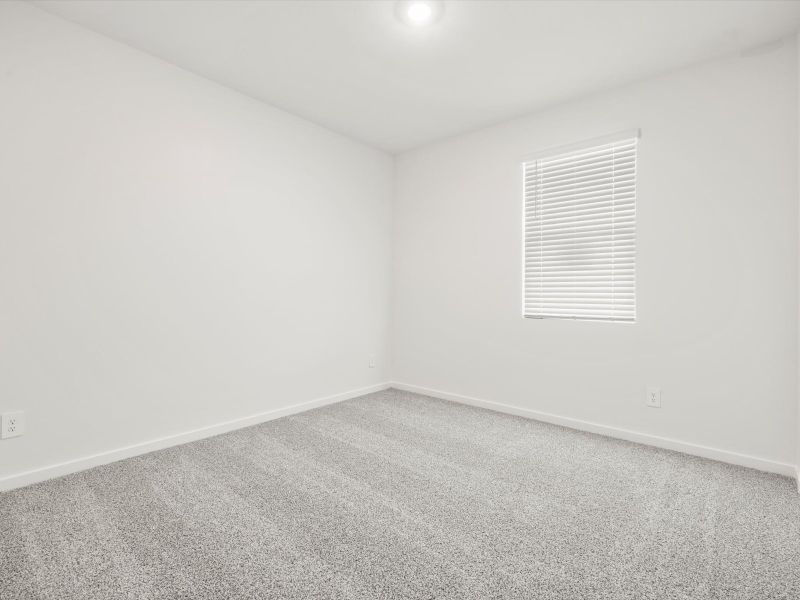 Spacious, unfurnished interior of a new home in Blossom Rock Reserve Series, Apache Junction (Image 13).