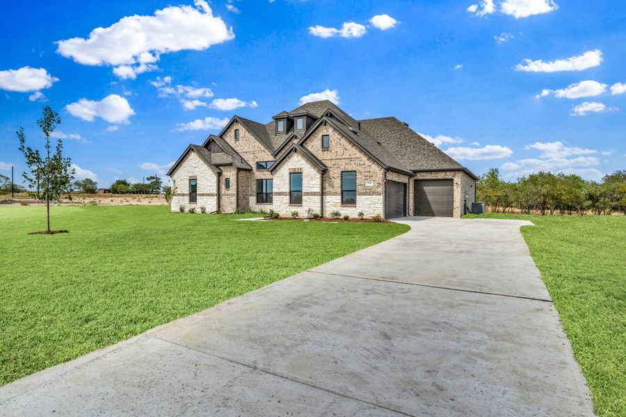 Front exterior of a new home in Legacy Trails, McLendon-Chisholm, TX, highlighting curb appeal (Image 14).