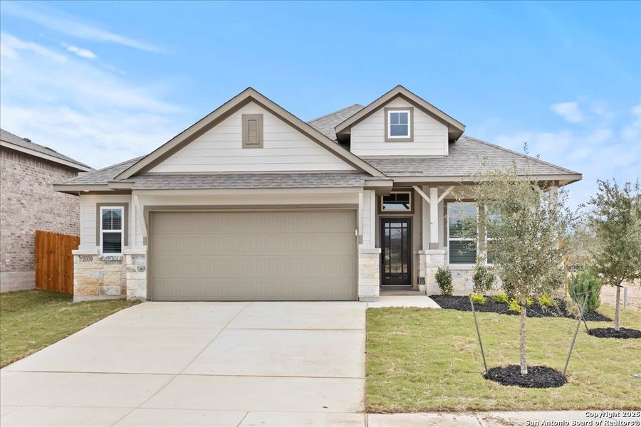 Front exterior of a new home in Stream Waters, Seguin, TX, highlighting curb appeal (Image 2).
