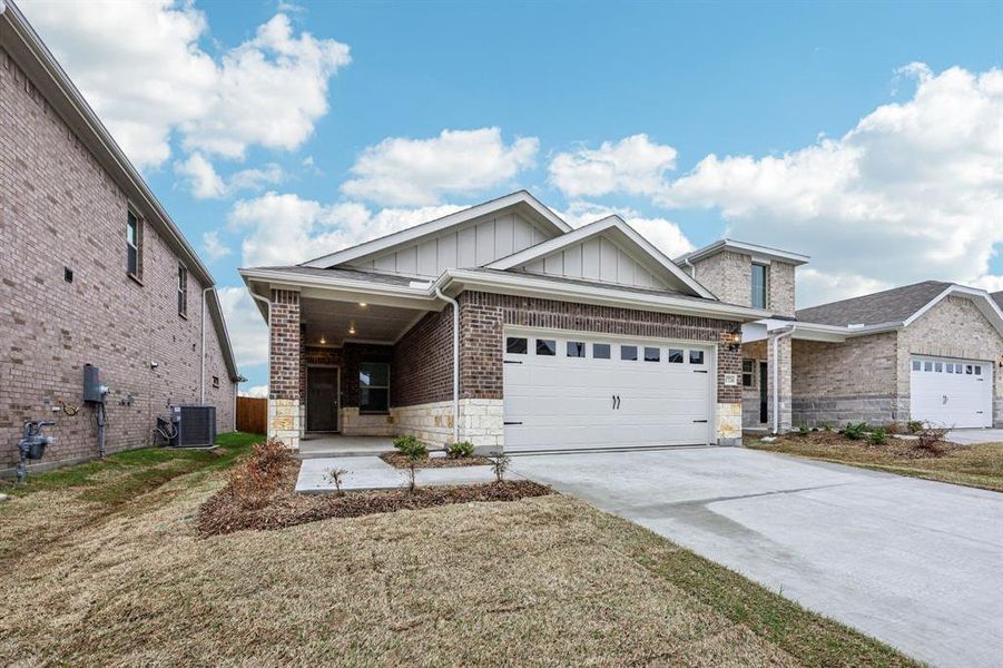 Front exterior of a new home in Parks at Foster Crossing - Spring Series, Anna, TX, highlighting curb appeal (Image 24).