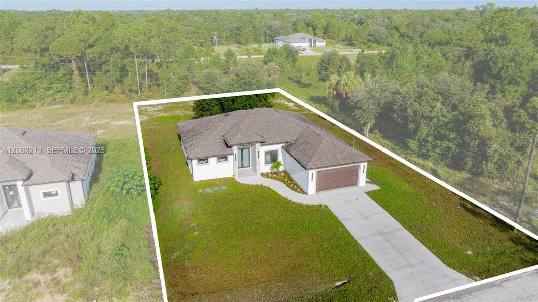 Front exterior of a new home in , Lehigh Acres, FL, highlighting curb appeal (Image 27).