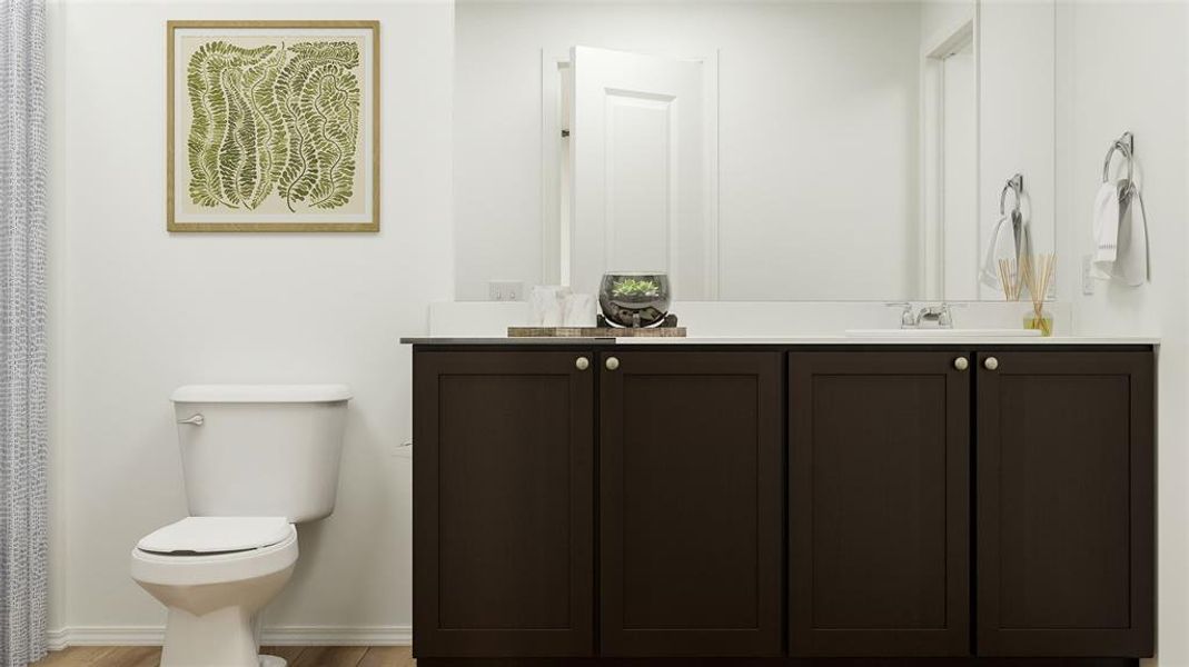 Bathroom with vanity and toilet