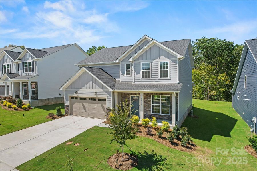 Front exterior of a new home in Forest Creek, Waxhaw, NC, highlighting curb appeal (Image 19).