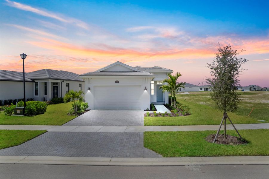 Front exterior of a new home in PGA Village Verano, Port St. Lucie, FL, highlighting curb appeal (Image 2).