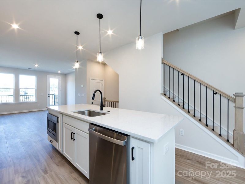 Large Central Island Ideal for Casual Dining and Meal Preparation.