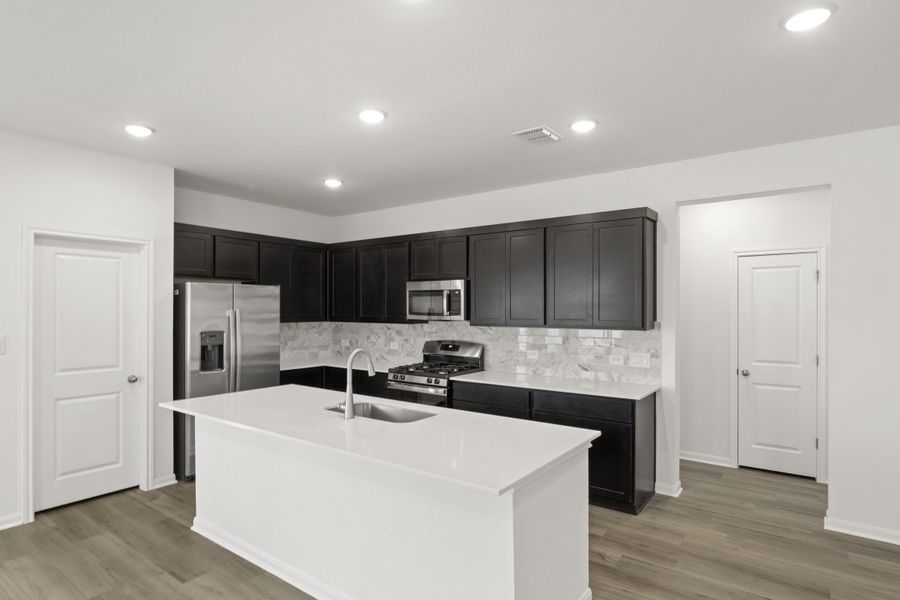 Furnished interior view inside a new home in Village at Three Oaks, Seguin (Image 5).