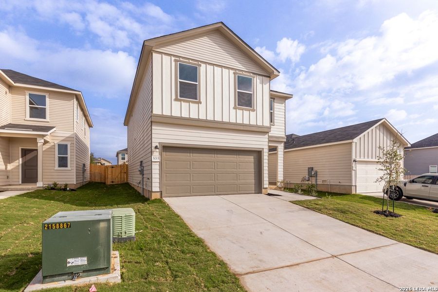 Front exterior of a new home in Southton Cove, Elmendorf, TX, highlighting curb appeal (Image 2). Front exterior of a new home in Southton Cove, Elmendorf, TX, highlighting curb appeal (Image 2).