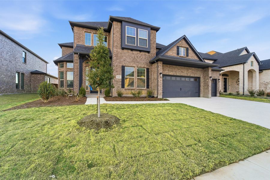 Front exterior of a new home in Green Meadows, Celina, TX, highlighting curb appeal (Image 2). Front exterior of a new home in Green Meadows, Celina, TX, highlighting curb appeal (Image 2).