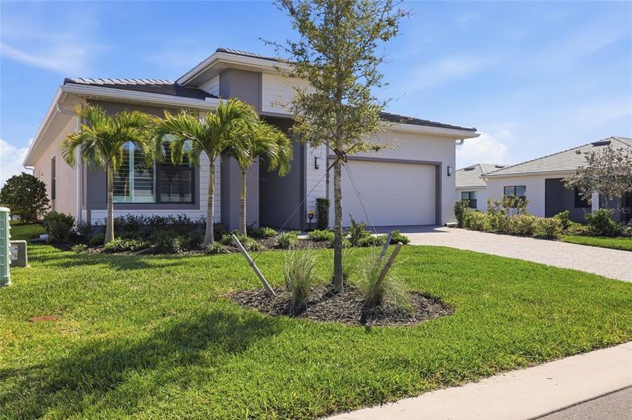 Front exterior of a new home in , Lakewood Ranch, FL, highlighting curb appeal (Image 2). Front exterior of a new home in , Lakewood Ranch, FL, highlighting curb appeal (Image 2).