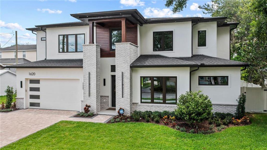 Front exterior of a new home in , Orlando, FL, highlighting curb appeal (Image 36). Front exterior of a new home in , Orlando, FL, highlighting curb appeal (Image 36).