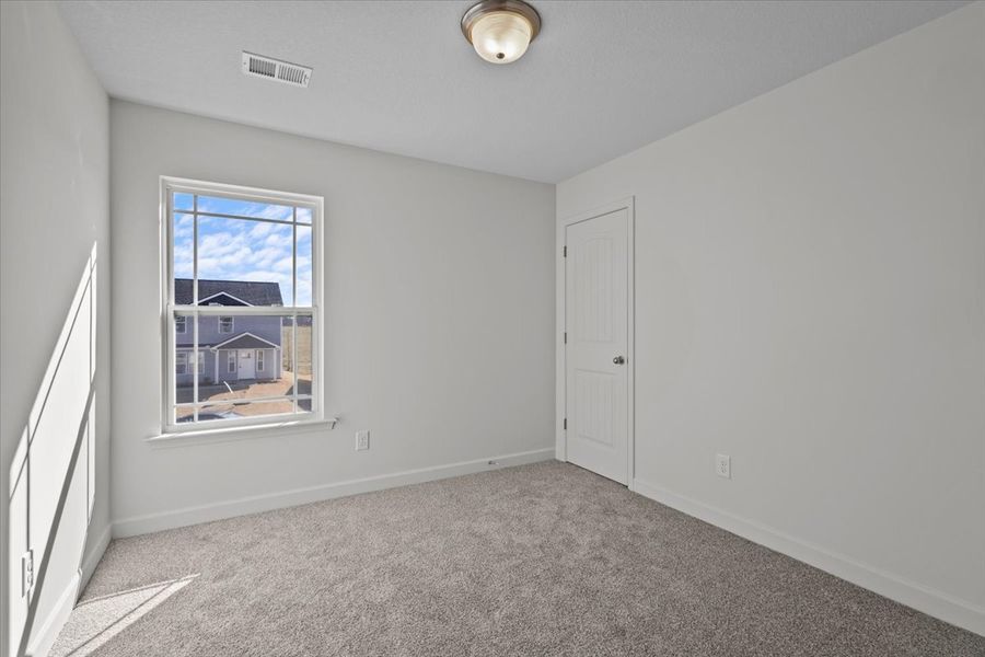 Representative unfurnished interior of a home built from the Roebuck by Enchanted Homes in Las Palomas Country Club Estates, La Vernia (Image 29).