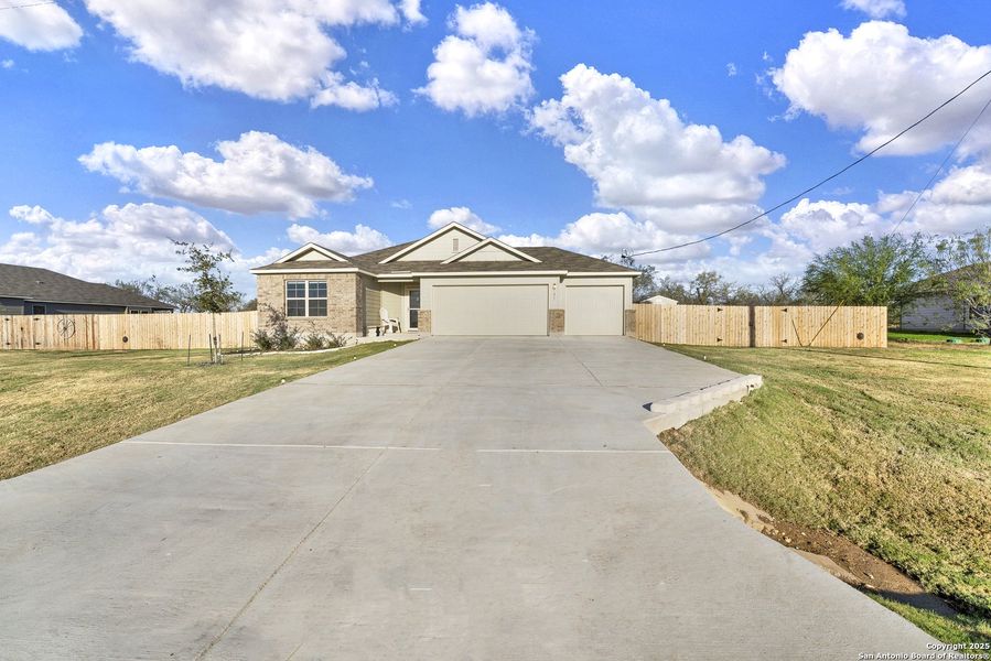 Front exterior of a new home in Chaparral Ranch, Floresville, TX, highlighting curb appeal (Image 23).