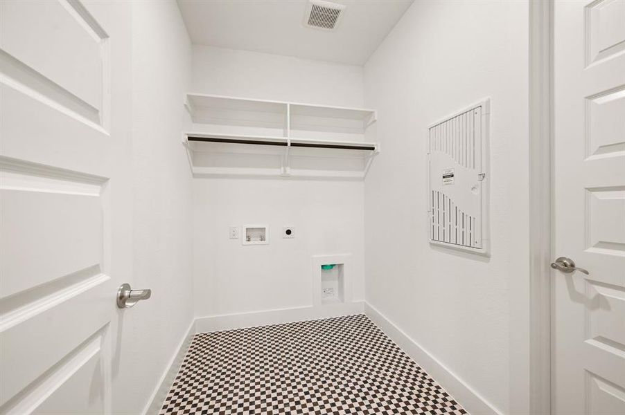 Laundry room featuring tile patterned floors, hookup for an electric dryer, and hookup for a washing machine