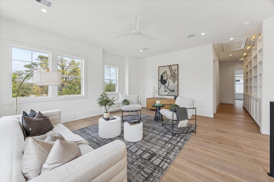 Central upstairs game room that serves as a perfect hangout, playroom, or media space.