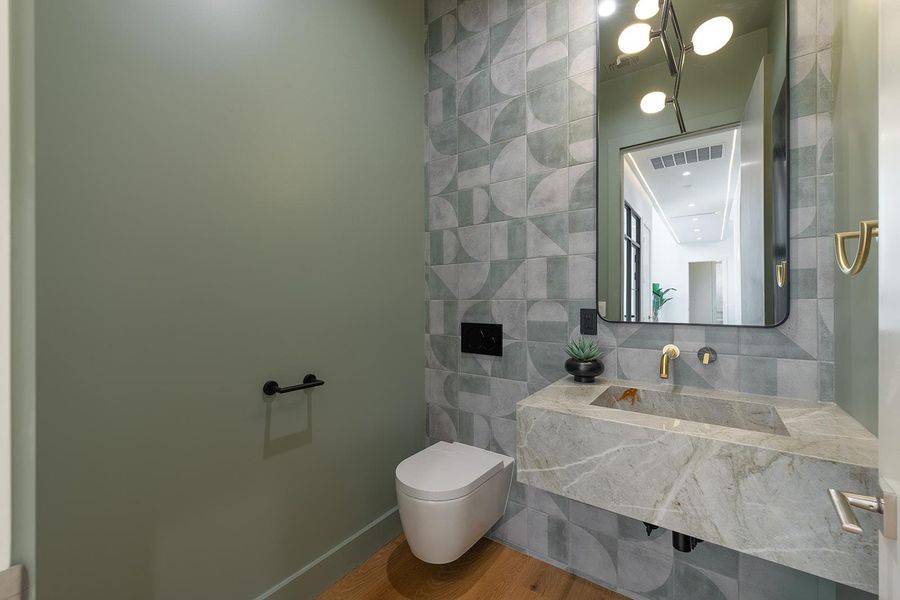 Powder main level has timeless tile style. Powder main level has timeless tile style.