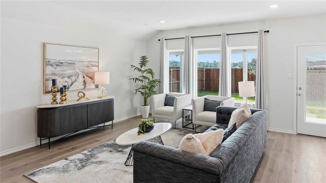 Living room featuring light wood-style floors and recessed lighting