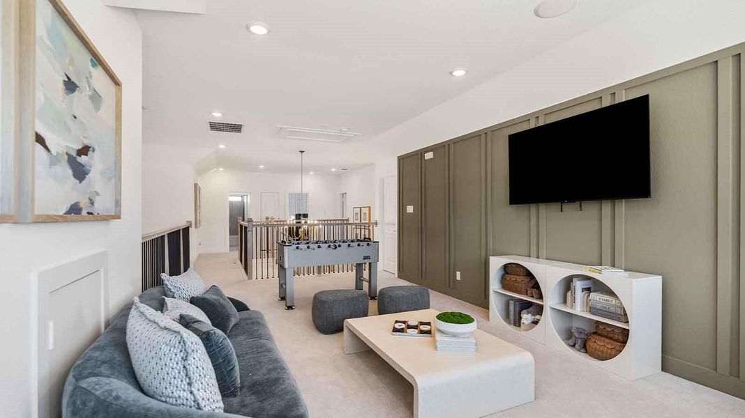 A spacious upstairs game room, great for additional entertainment for the whole family.