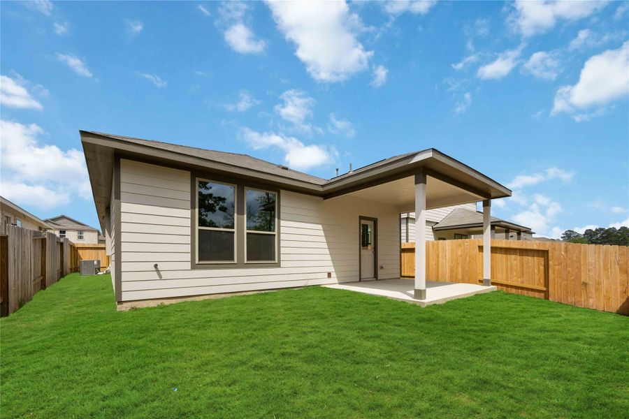 Exterior details and patio area of a home in Meadow Park, Conroe (Image 4).