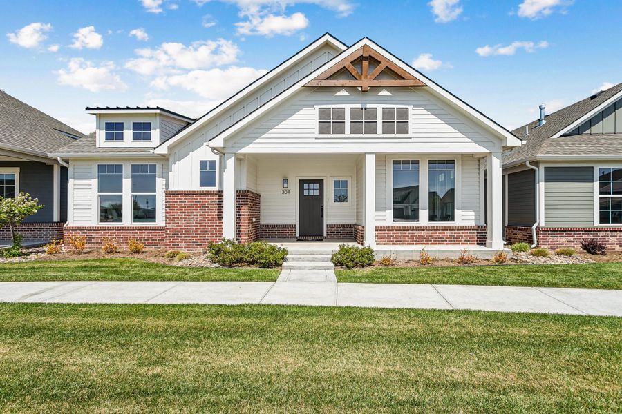 Front exterior of a new home in The Courtyards at Cornerstone, Andover, KS, highlighting curb appeal (Image 1). Front exterior of a new home in The Courtyards at Cornerstone, Andover, KS, highlighting curb appeal (Image 1).