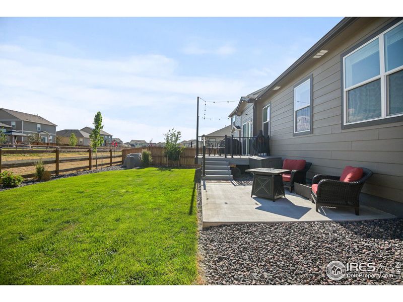 Fully landscaped, irrigation system with drip lines, custom deck and patio