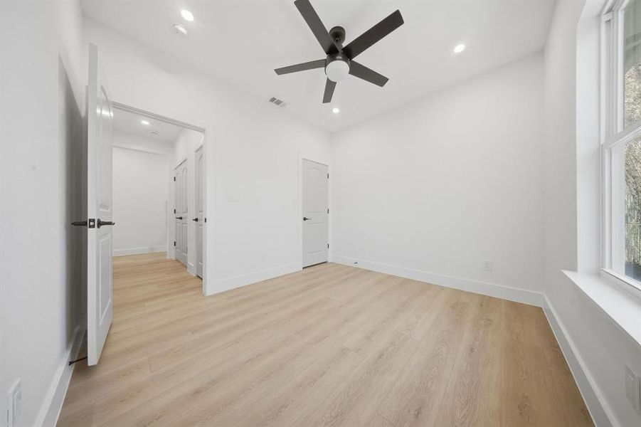Bedroom to the right of the laundry room and garage.