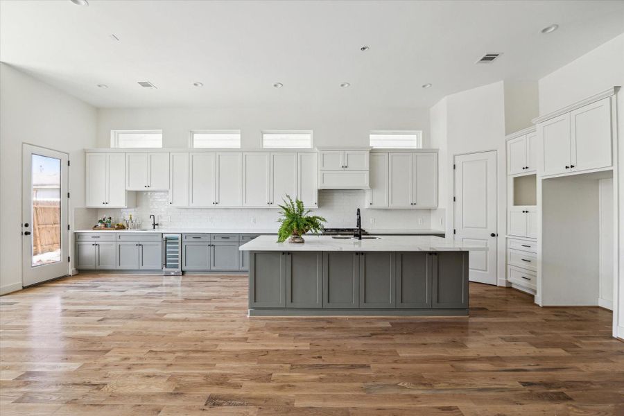 16x13 Kitchen. Bosch refrigerator and microwave included in appliance package. (on backorder) Wine cooler and wet bar. 16x13 Kitchen. Bosch refrigerator and microwave included in appliance package. (on backorder) Wine cooler and wet bar.