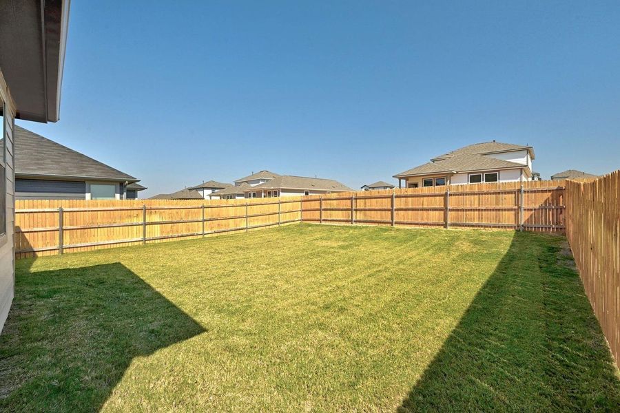 Exterior details and patio area of a home in Trinity Ranch, Elgin (Image 23). Exterior details and patio area of a home in Trinity Ranch, Elgin (Image 23).