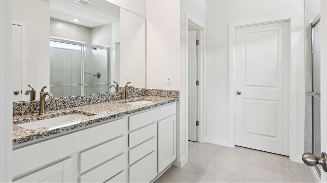 Baker Floor Plan Primary Suite Bathroom by DRB Homes Baker Floor Plan Primary Suite Bathroom by DRB Homes