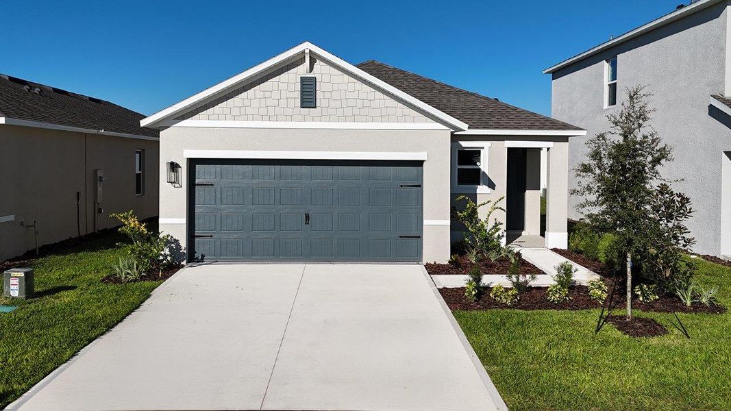 Front exterior of a new home in Wynnstone, Davenport, FL, highlighting curb appeal (Image 1). Front exterior of a new home in Wynnstone, Davenport, FL, highlighting curb appeal (Image 1).