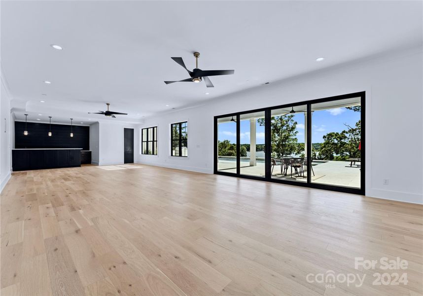 Fully finished walk-out basement with doors to the pool