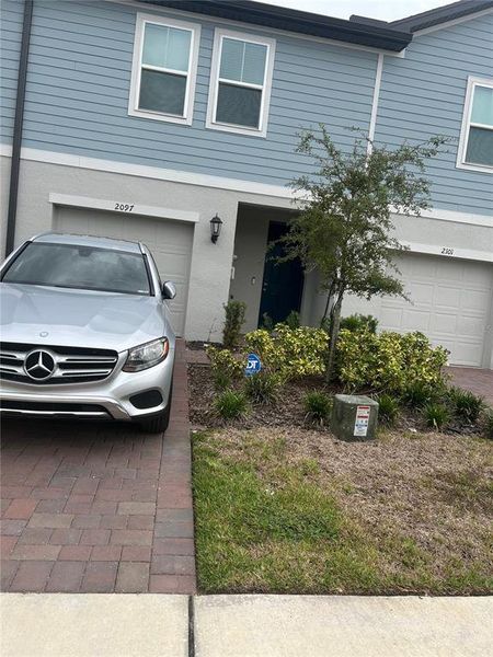Front exterior of a new home in , Orlando, FL, highlighting curb appeal (Image 1).