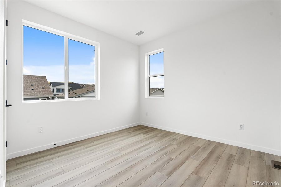 Spacious, unfurnished interior of a new home in Tribute at Lyric, Lone Tree (Image 21).