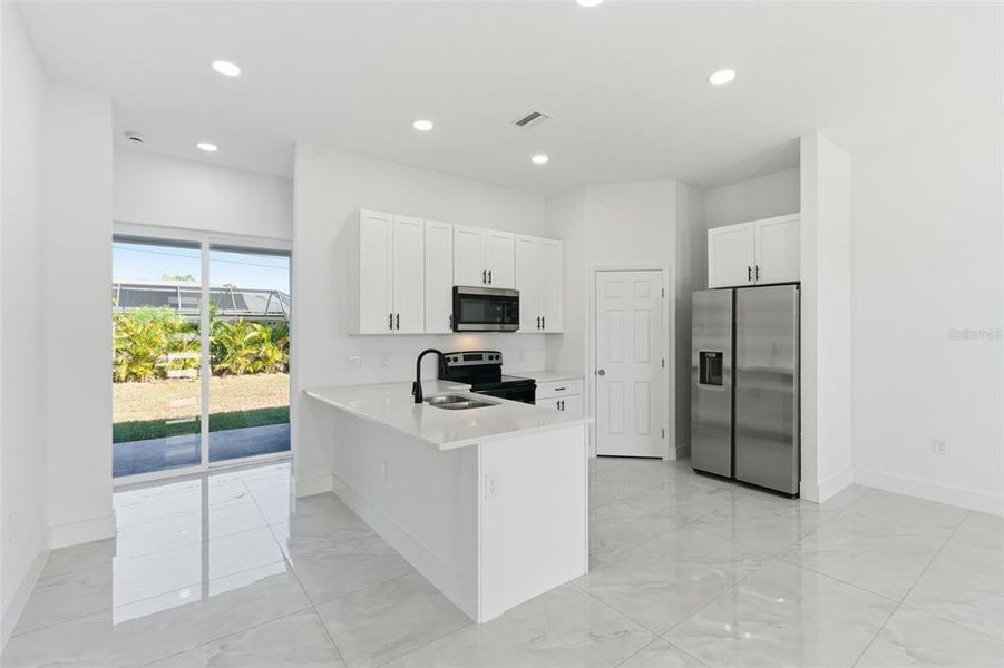Furnished interior view inside a new home in , Port Charlotte (Image 8).