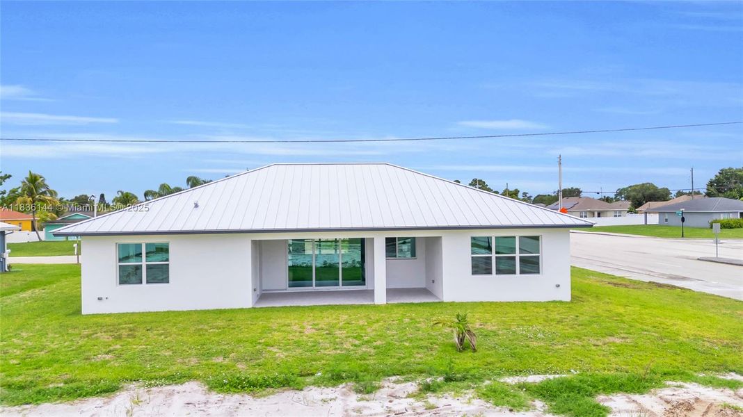 Front exterior of a new home in , Port St. Lucie, FL, highlighting curb appeal (Image 2).