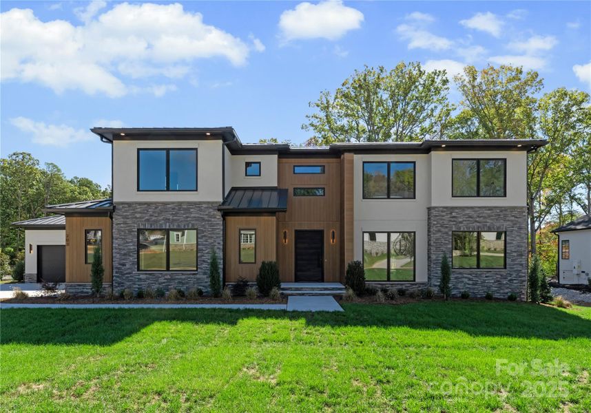 Front exterior of a new home in , Matthews, NC, highlighting curb appeal (Image 1).