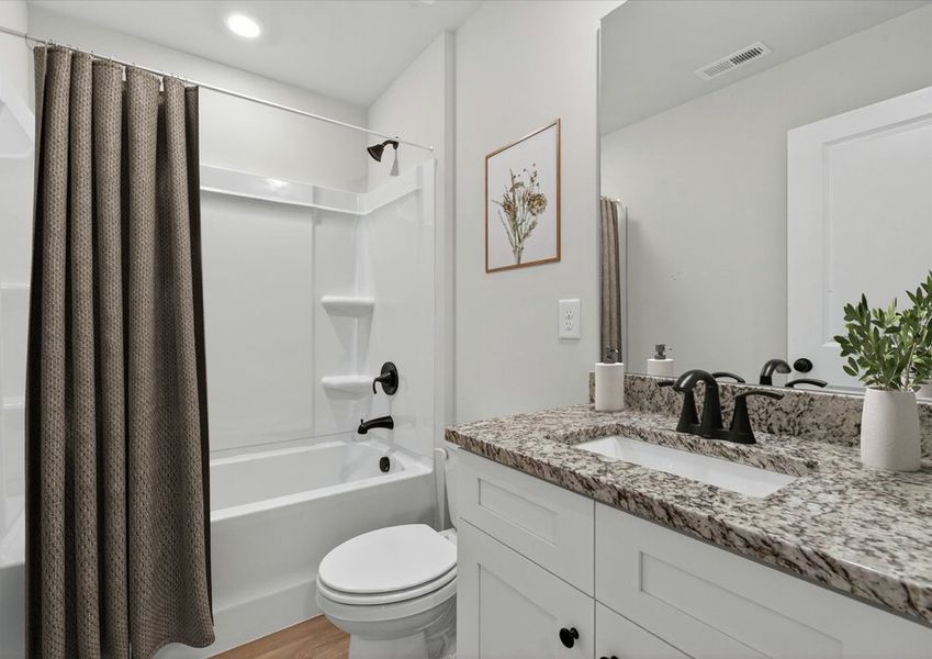 Secondary bathroom with large soaking tub