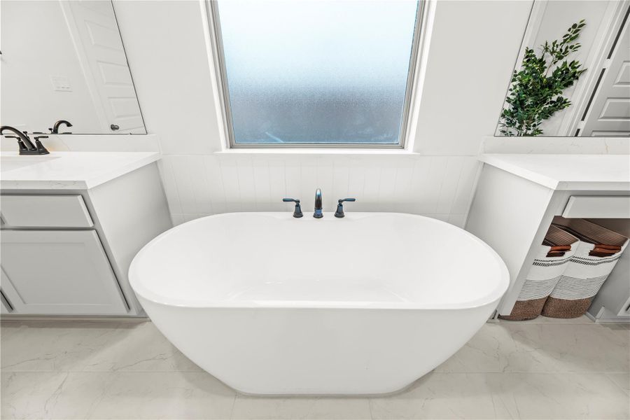 Relax and let the day melt away in the deep freestanding soaking tub, your personal retreat for pure, unhurried indulgence.