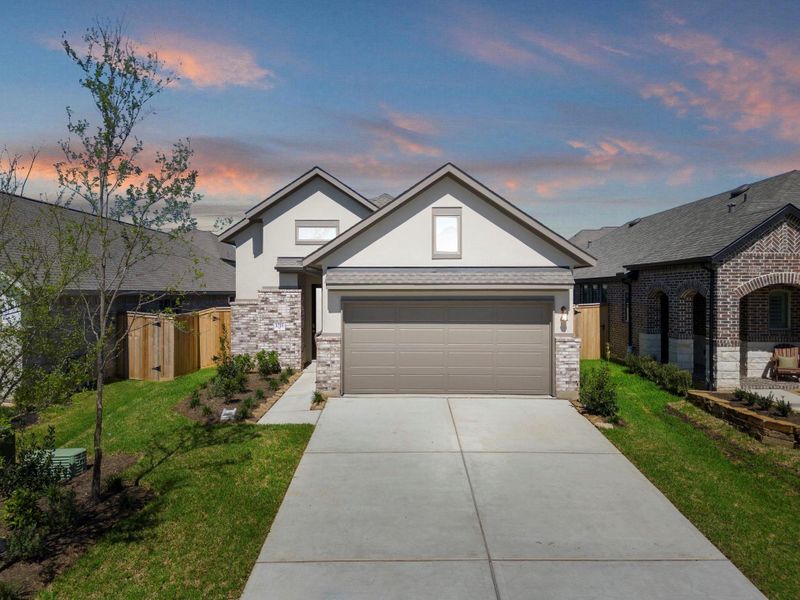 Front exterior of a new home in Grand Central Park, Conroe, TX, highlighting curb appeal (Image 22).