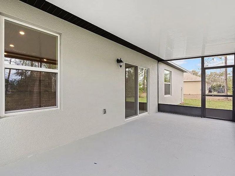 Exterior details and patio area of a home in Royal Highlands, Brooksville (Image 22).