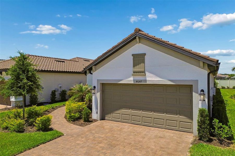 Front exterior of a new home in , Wesley Chapel, FL, highlighting curb appeal (Image 26).
