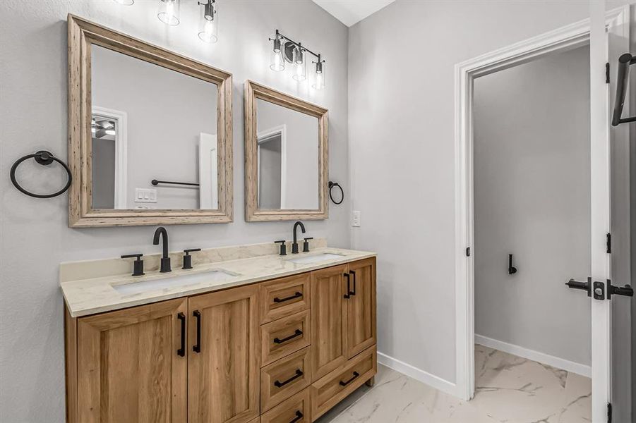 A separate toilet room in the primary bath and storage in the vanity.