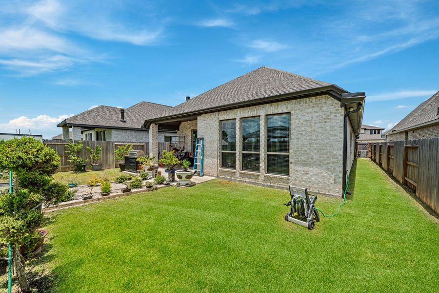 Exterior details and patio area of a home in Marvida, Cypress (Image 2).