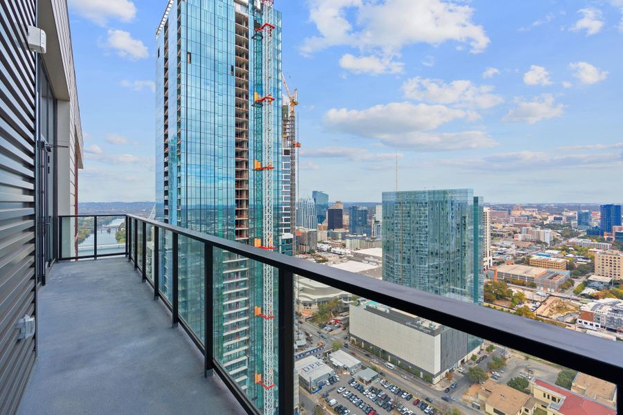 The 158 sqft balcony provides an outdoor living space with breathtaking views of the Austin Skyline.